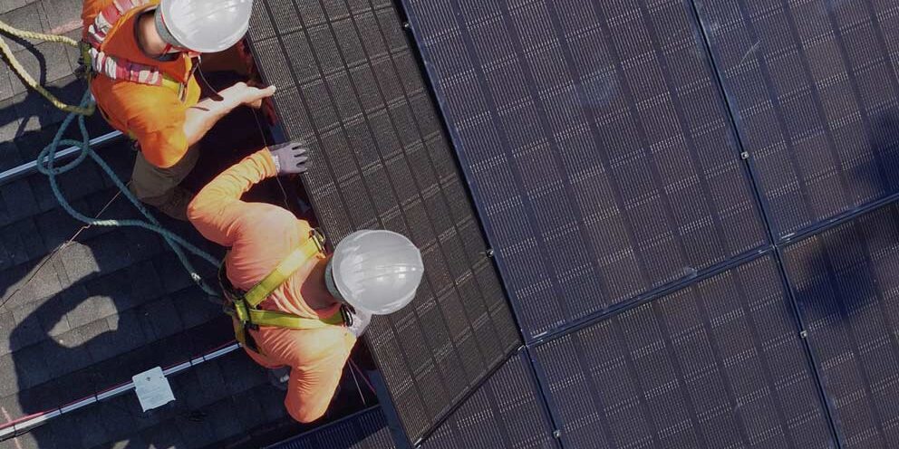 Solar installers on roof