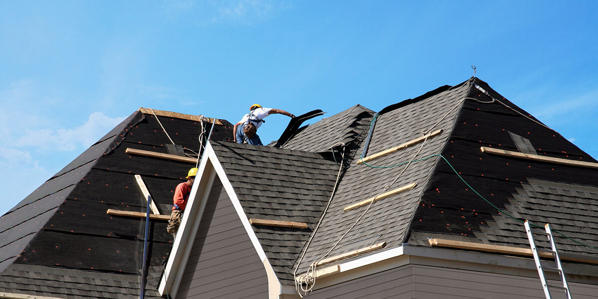 Workers installing a new roof